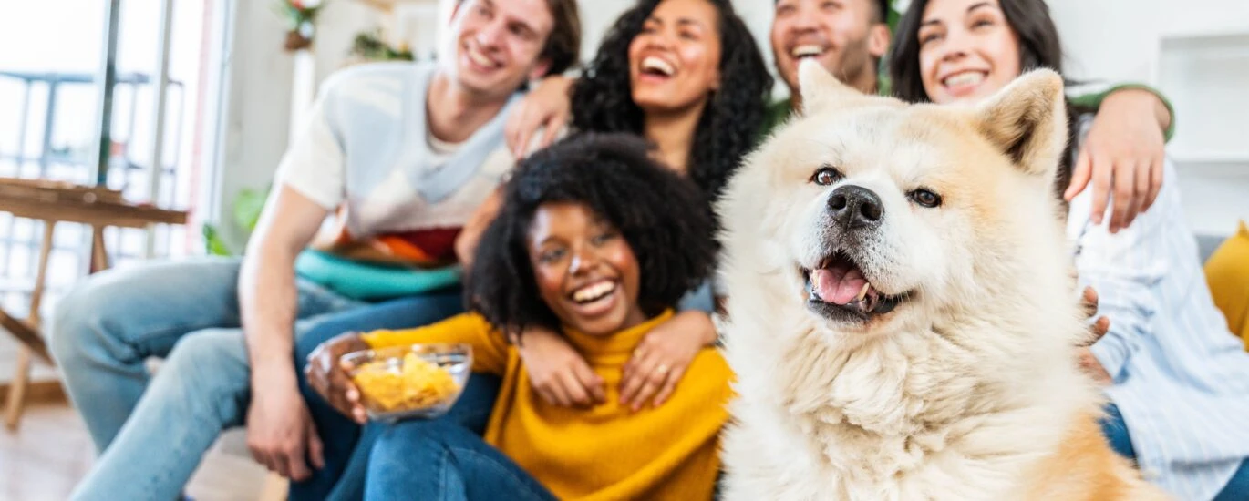 Blended famlily hanging out with dog.