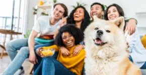Blended famlily hanging out with dog.