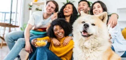 Blended famlily hanging out with dog.