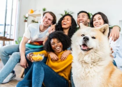Blended famlily hanging out with dog.