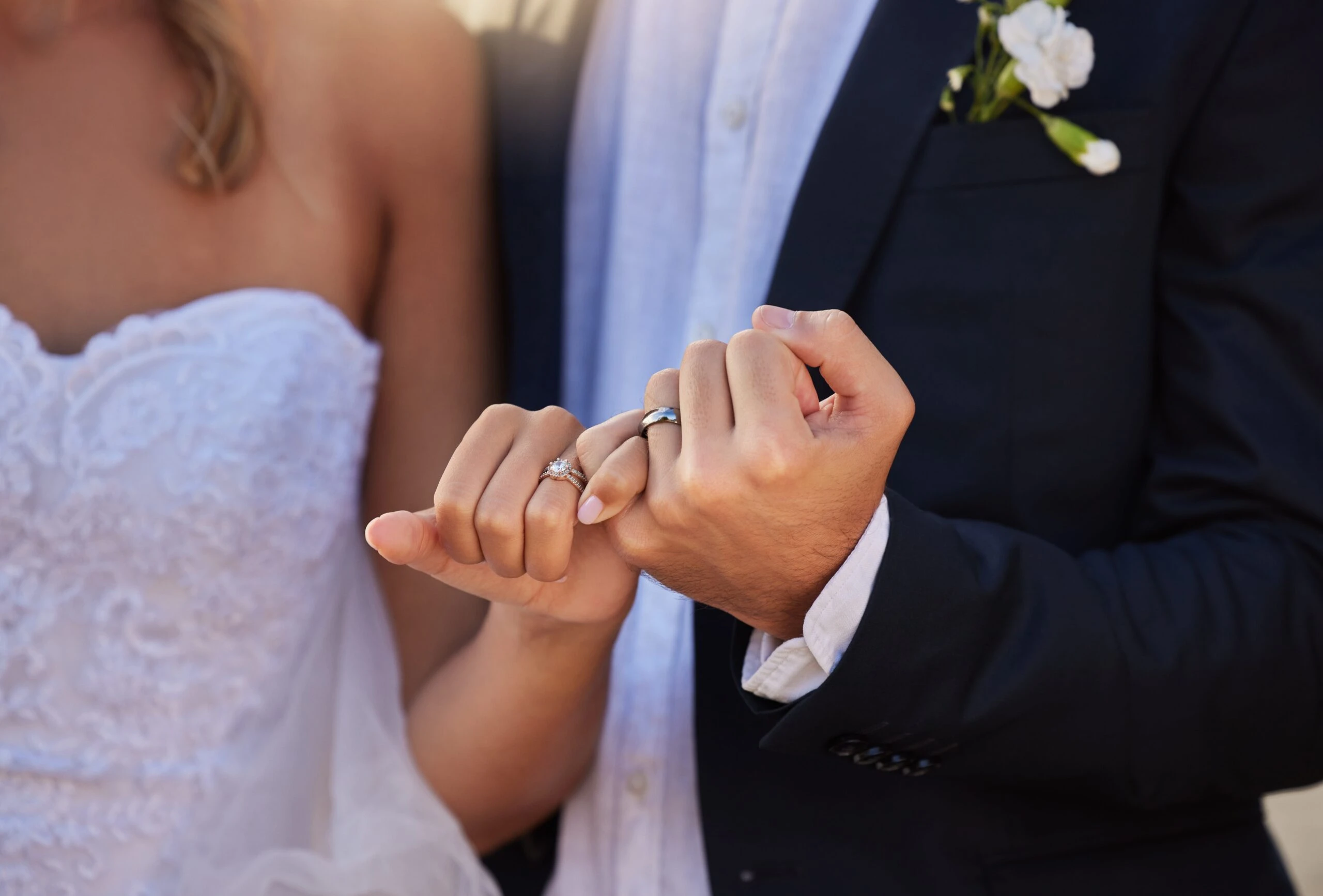 Husband and wife holding hands after wedding. 